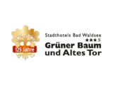 Grüner Baum und Altes Tor Logo